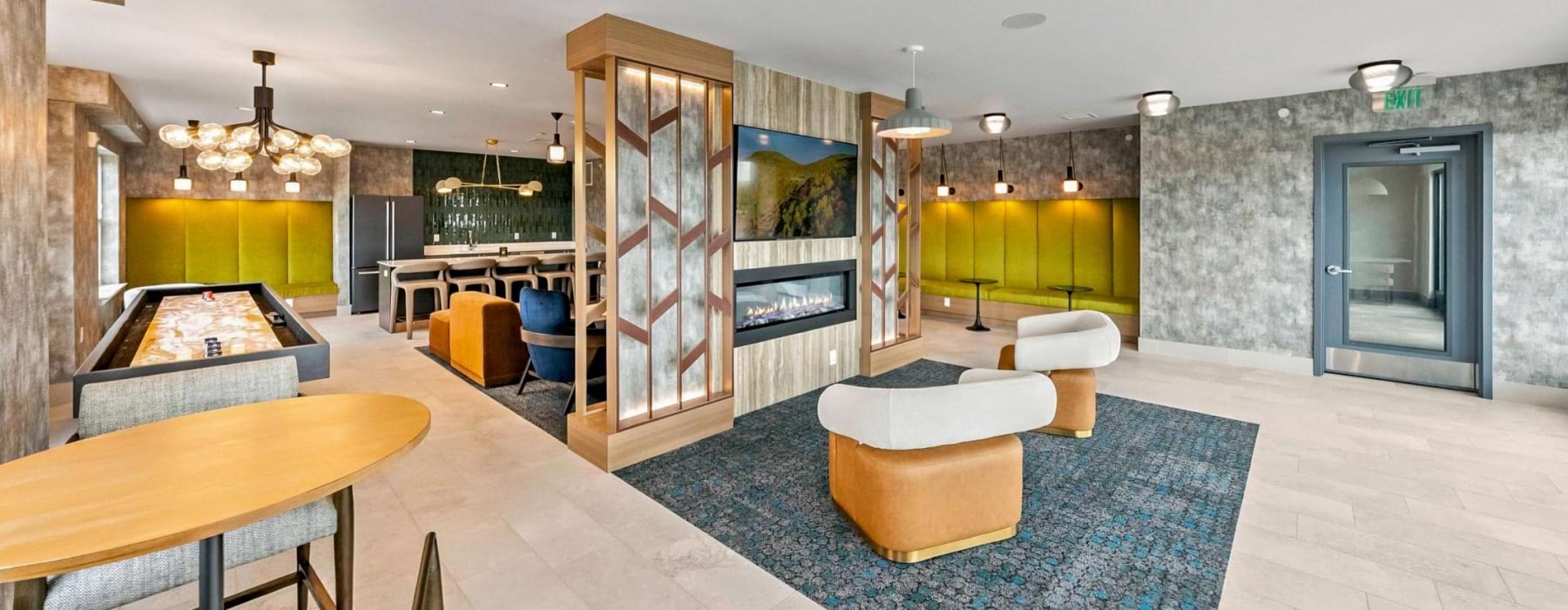 a clubroom with various tables and chairs